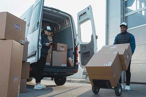two people delivering packages