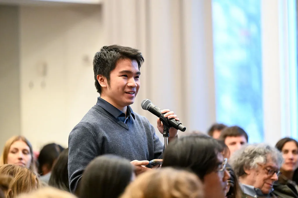 Man from the audience asking a question 