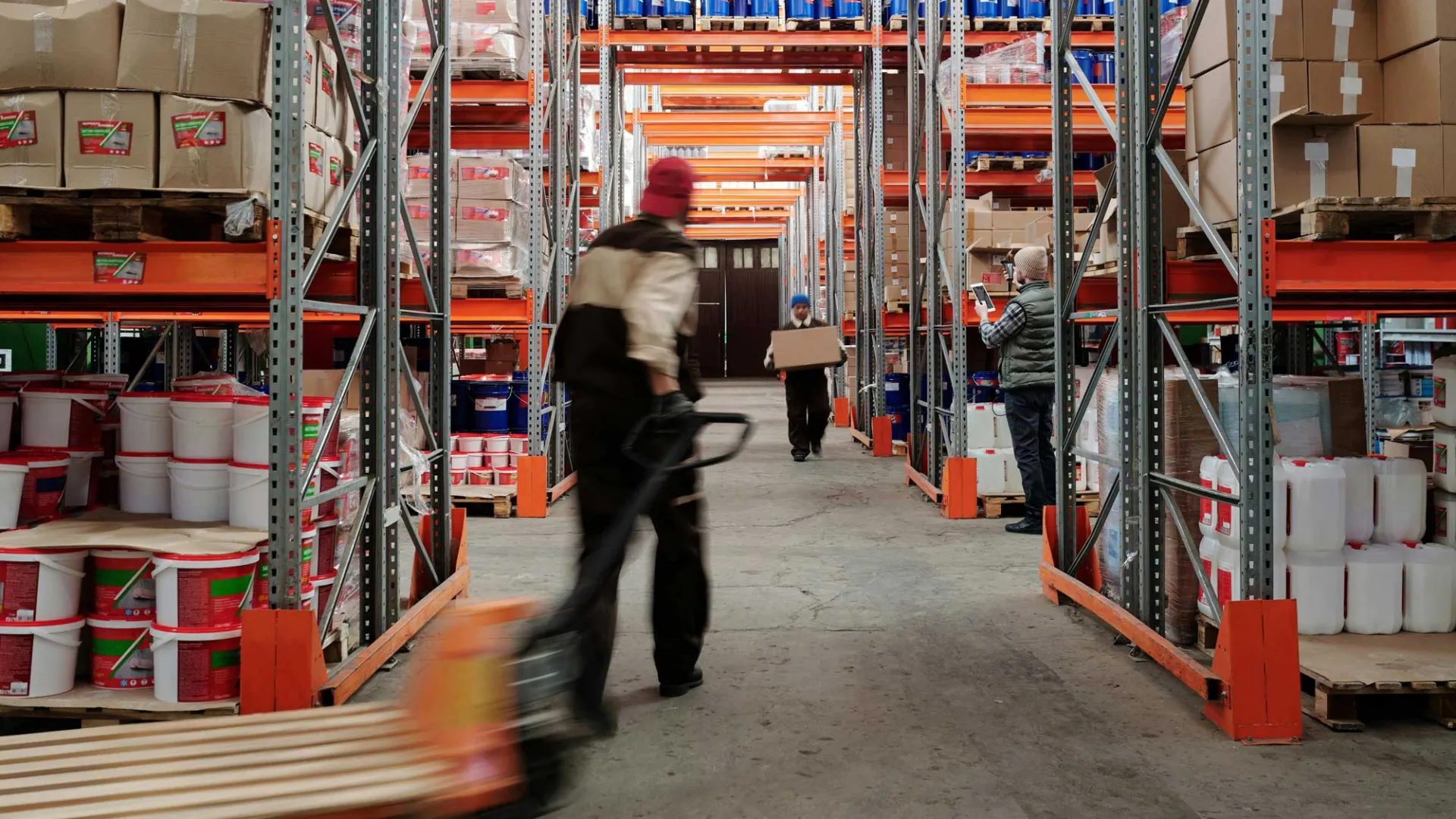 Photo of Men Working in a Warehouse
